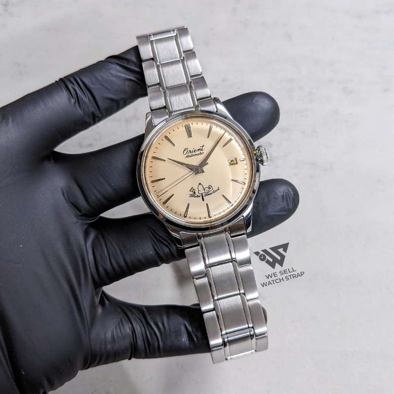 orient-snoopy-limited-edition-salmon-beige-dial-on-genuine-bracelet